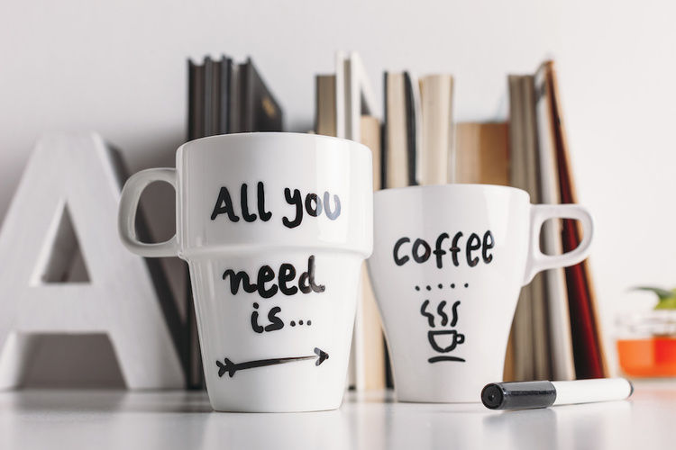 Two white mugs with black writing on them | Blog | Greystar